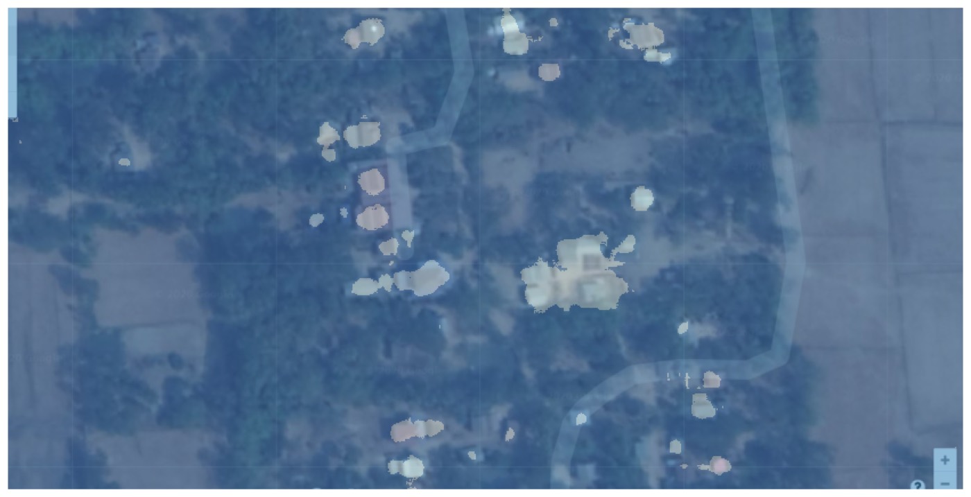 The same tile with the model's predicted rooftop segmentation overlaid, tracing actual roof outlines.